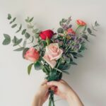 Person Holding Bunch of Flowers