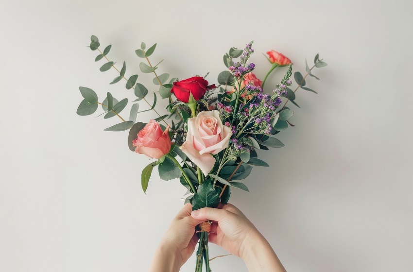 Person Holding Bunch of Flowers